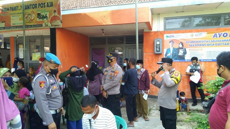 Polisi Kawal Penyaluran BST, pringsewu.lappung.com
